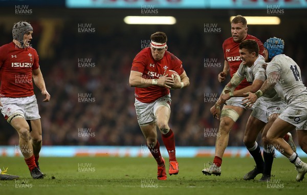 230219 - Wales v England - Guinness 6 Nations Championship - Josh Adams of Wales gets past Henry Slade of England