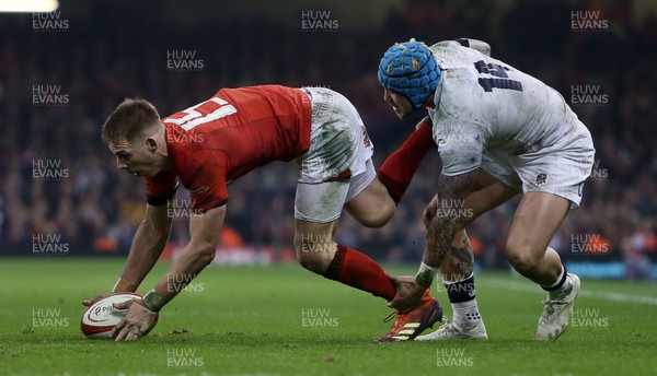 230219 - Wales v England - Guinness 6 Nations Championship - Liam Williams of Wales is tackled by Jack Nowell of England