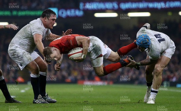 230219 - Wales v England - Guinness 6 Nations Championship - Liam Williams of Wales is tackled by Jack Nowell of England