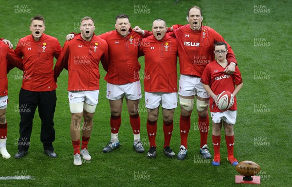 230219 - Wales v England - Guinness 6 Nations Championship - Jonathan Davies, Ross Moriarty, Rob Evans, Ken Owens and Alun Wyn Jones of Wales sing the anthem