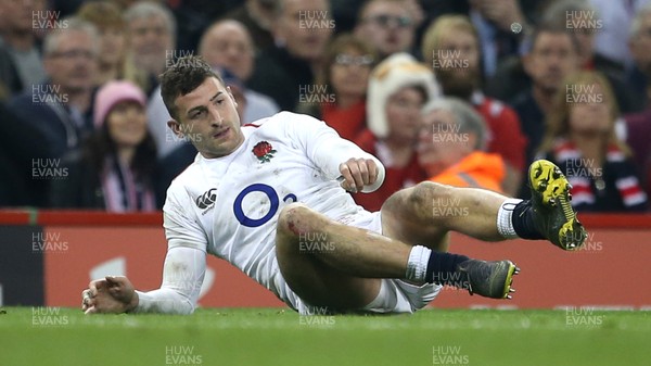 230219 - Wales v England - Guinness 6 Nations Championship - Jonny May of England gets up after a blow to the head
