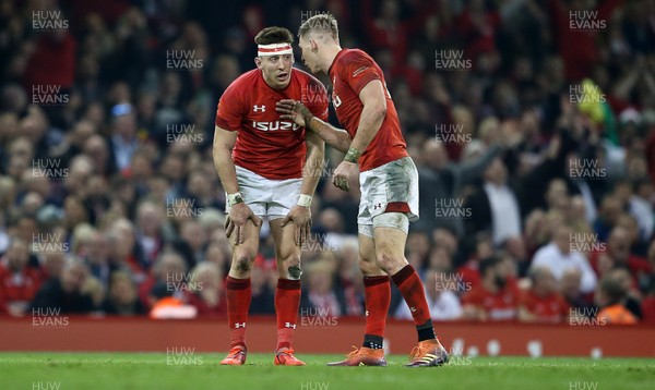 230219 - Wales v England - Guinness 6 Nations Championship - Josh Adams talks to Liam Williams of Wales