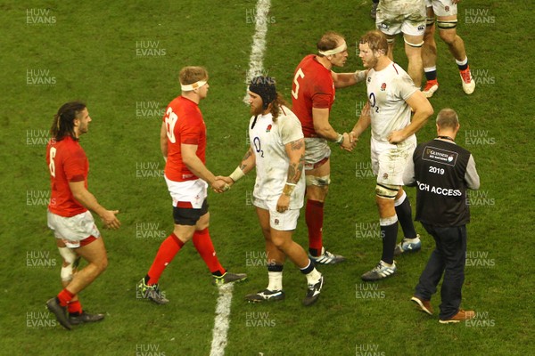 230219 - Wales v England -  Guinness 6 Nations -  Players of Wales and England shake hands after the final whistle