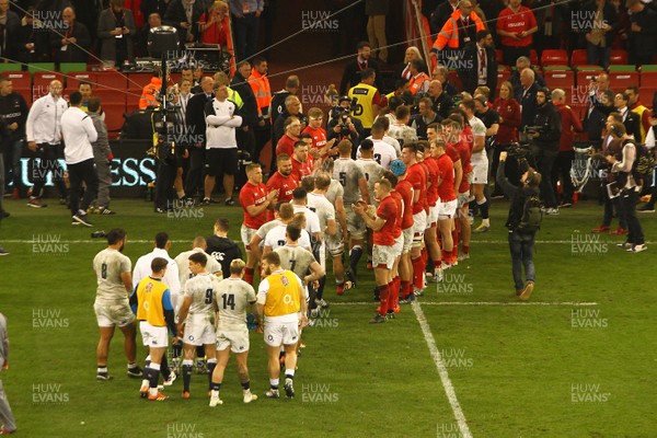 230219 - Wales v England -  Guinness 6 Nations -  Players of Wales applaud the players of England off the field after the final whistle