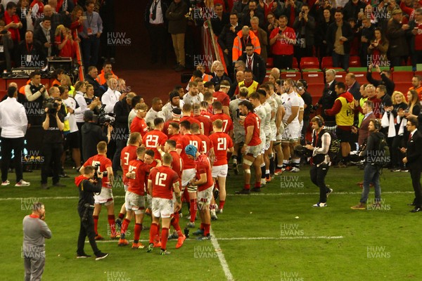 230219 - Wales v England -  Guinness 6 Nations -  Players of Wales are applauded by the players of England after the final whistle