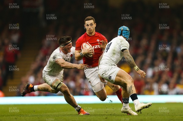 230219 - Wales v England, Guinness Six Nations - George North of Wales is tackled by Jack Nowell of England and Jamie George of England