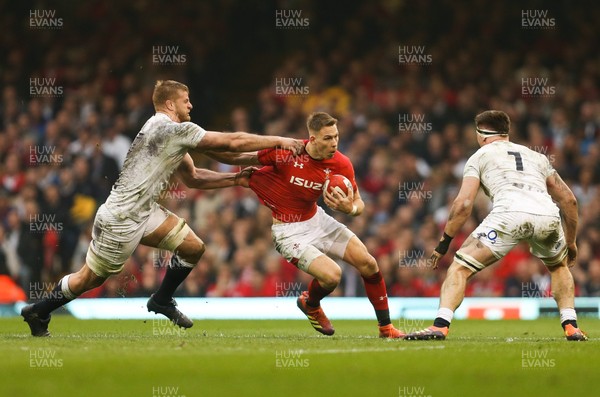 230219 - Wales v England, Guinness Six Nations - Liam Williams of Wales takes on George Kruis of England and Tom Curry of England
