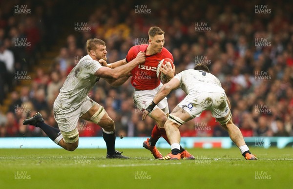 230219 - Wales v England, Guinness Six Nations - Liam Williams of Wales takes on George Kruis of England and Tom Curry of England