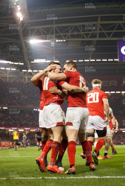 230219 - Wales v England, Guinness Six Nations - Jonathan Davies of Wales leads the celebrations after Josh Adams of Wales scores try