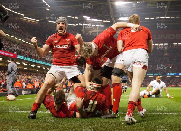 230219 - Wales v England, Guinness Six Nations - Jonathan Davies of Wales leads the celebrations after Josh Adams of Wales scores try