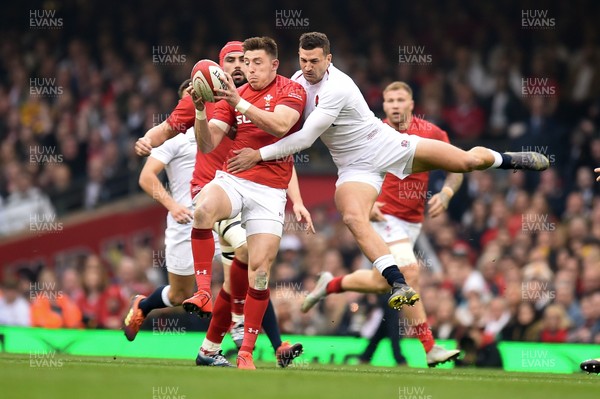 230219 - Wales v England - Guinness Six Nations - Josh Adams of Wales  beats Jonny May of England to the high ball