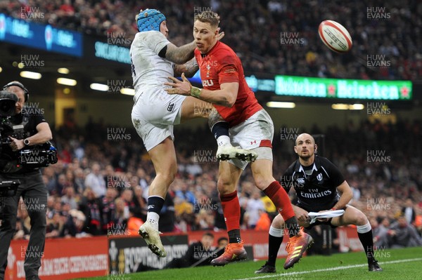 230219 - Wales v England - Guinness Six Nations - Jack Nowell of England beats Liam Williams of Wales  to the high ball