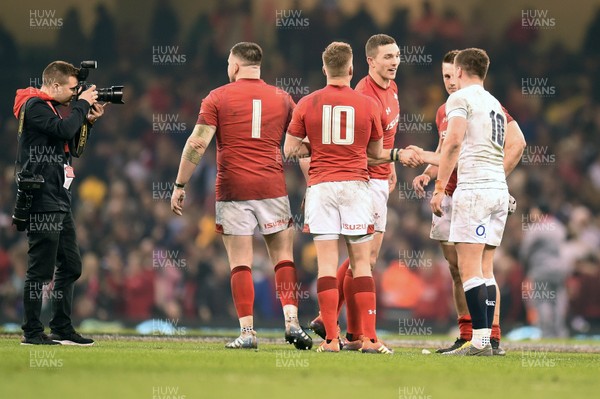 230219 - Wales v England - Guinness Six Nations - George North of Wales  shakes hands with Owen Farrell of England 