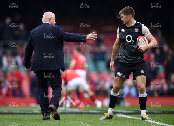 230219 - Wales v England - Guinness Six Nations Championship -  Wales head coach Warren Gatland shakes hands with Owen Farrell of England before the match