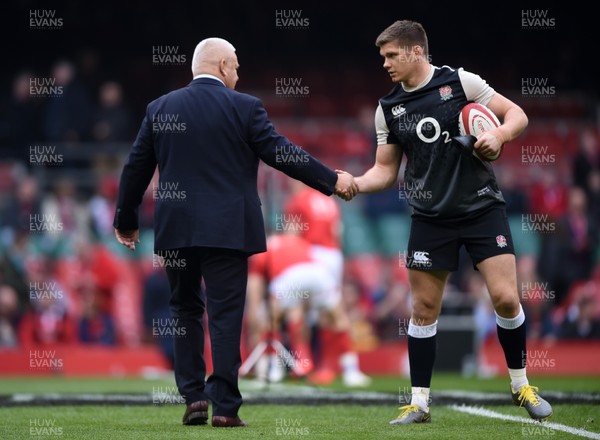 230219 - Wales v England - Guinness Six Nations Championship -  Wales head coach Warren Gatland shakes hands with Owen Farrell of England before the match