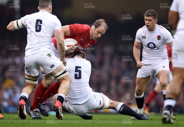 230219 - Wales v England - Guinness Six Nations Championship -  Alun Wyn Jones of Wales is tackled by George Kruis of England 