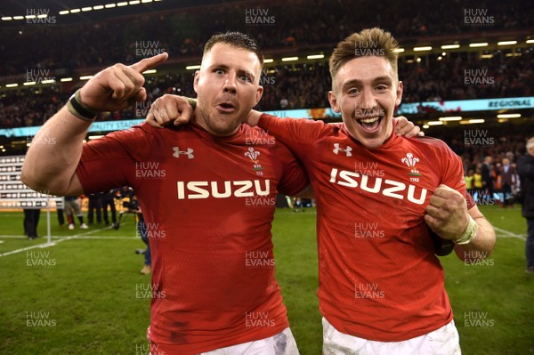 230219 - Wales v England - Guinness Six Nations - Rob Evans and Josh Adams of Wales celebrate win at the end of the game