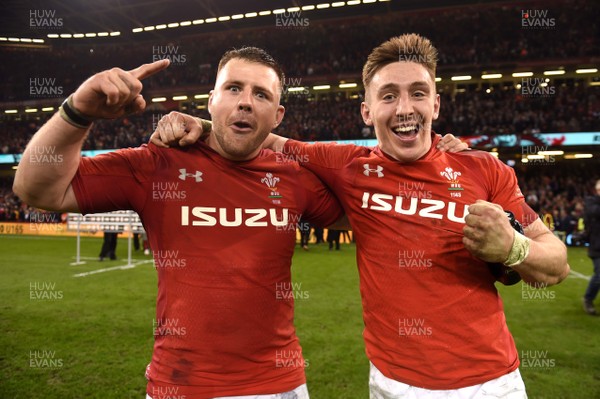 230219 - Wales v England - Guinness Six Nations - Rob Evans and Josh Adams of Wales celebrate win at the end of the game