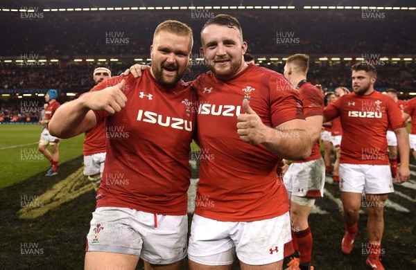 230219 - Wales v England - Guinness Six Nations - Tomas Francis and Dillon Lewis of Wales celebrate win at the end of the game