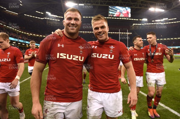 230219 - Wales v England - Guinness Six Nations - Ross Moriarty and Gareth Anscombe of Wales celebrate win at the end of the game