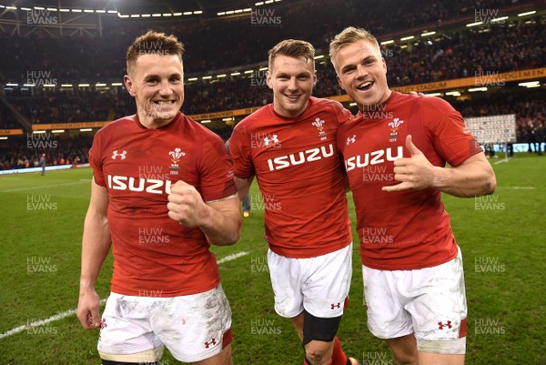 230219 - Wales v England - Guinness Six Nations - Jonathan Davies, Dan Biggar and Gareth Anscombe of Wales celebrate win at the end of the game