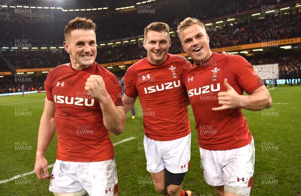 230219 - Wales v England - Guinness Six Nations - Jonathan Davies, Dan Biggar and Gareth Anscombe of Wales celebrate win at the end of the game