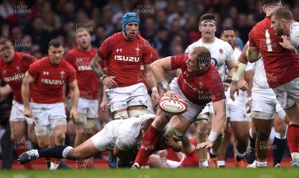 230219 - Wales v England - Guinness Six Nations - Alun Wyn Jones of Wales is tackled by Ben Moon of England