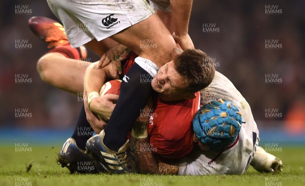 230219 - Wales v England - Guinness Six Nations - Dan Biggar of Wales is tackled by Jack Nowell of England