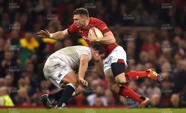 230219 - Wales v England - Guinness Six Nations - Dan Biggar of Wales is tackled by Jamie George of England