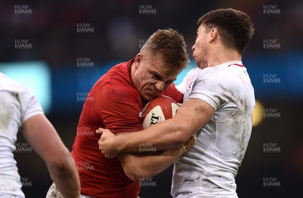 230219 - Wales v England - Guinness Six Nations - Gareth Anscombe of Wales is tackled by Ben Youngs of England