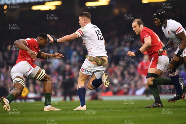 250223 - Wales v England - Guinness Six Nations 2023 - Freddie Steward of England pulls up his shorts after tackle by Taulupe Faletau of Wales