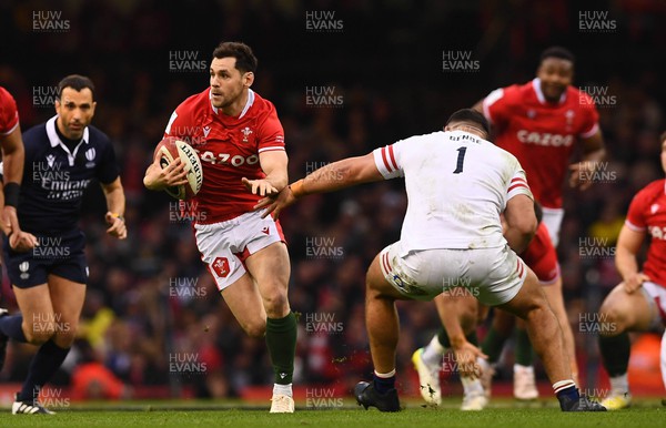 250223 - Wales v England - Guinness Six Nations 2023 - Tomos Williams of Wales gets past Ellis Genge of England