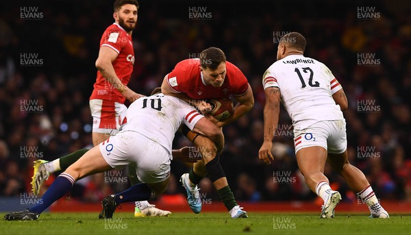 250223 - Wales v England - Guinness Six Nations 2023 - Mason Grady of Wales is tackled by Owen Farrell of England
