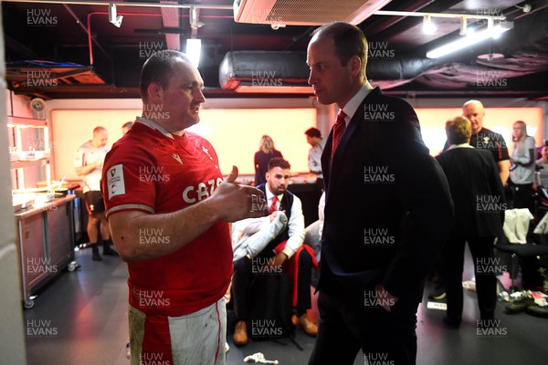 250223 - Wales v England - Guinness Six Nations 2023 - Ken Owens of Wales with HRH Prince William, The Prince of Wales in the Wales dressing room after the match