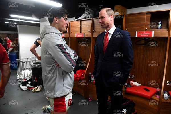 250223 - Wales v England - Guinness Six Nations 2023 - Louis Rees-Zammit of Wales with HRH Prince William, The Prince of Wales in the Wales dressing room after the match