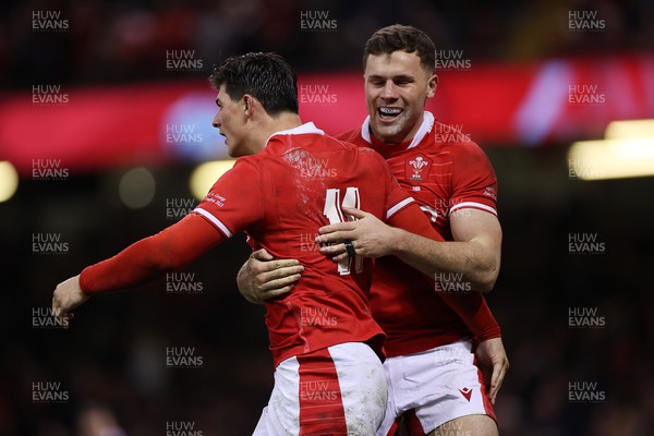 250223 - Wales v England - Guinness 6 Nations - Louis Rees-Zammit of Wales celebrates scoring a try with Mason Grady