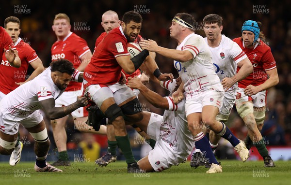 250223 - Wales v England - Guinness 6 Nations - Taulupe Faletau of Wales is tackled by Mako Vunipola of England 