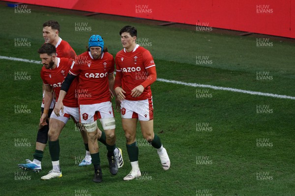 250223 - Wales v England - Guinness Six Nations - Louis Rees-Zammit of Wales celebrates with Justin Tipuric after scoring a try