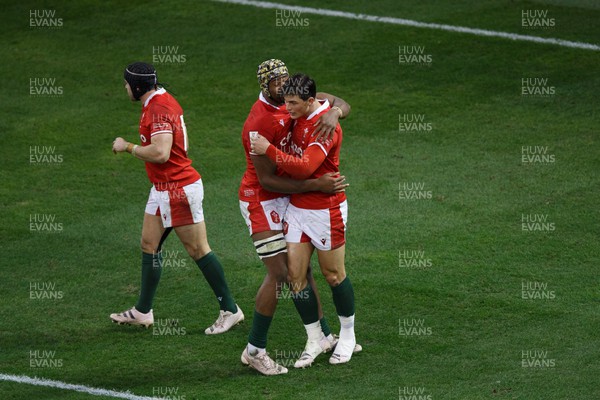 250223 - Wales v England - Guinness Six Nations - Louis Rees-Zammit of Wales celebrates with Christ Tshiunza after scoring a try