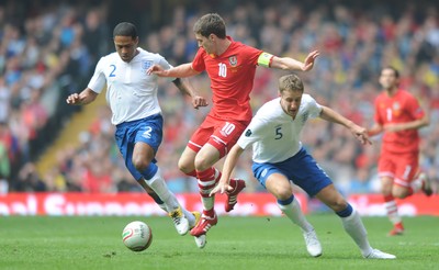 26.03.11 - Wales v England - Euro 2012 Qualifier - Aaron Ramsey of Wales takes on Michael Dawson and Glen Johnson of England. 