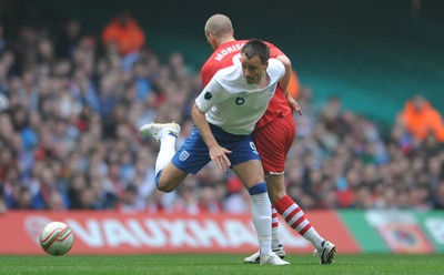 26.03.11 - Wales v England - Euro 2012 Qualifier - John Terry of England is challenged by Steve Morison of Wales. 