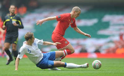 26.03.11 - Wales v England - Euro 2012 Qualifier - Steve Morison of Wales is tackled by Michael Dawson of England. 