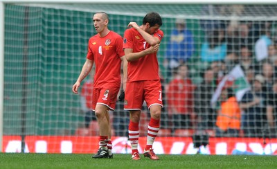 26.03.11 - Wales v England - Euro 2012 Qualifier - Andrew Crofts and Joe Ledley of Wales look dejected at the end of the game. 