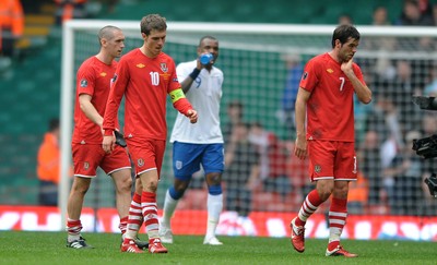 26.03.11 - Wales v England - Euro 2012 Qualifier - Andrew Crofts, Aaron Ramsey and Joe Ledley of Wales look dejected at the end of the game. 