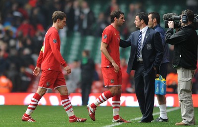 26.03.11 - Wales v England - Euro 2012 Qualifier - Aaron Ramsey and Joe Ledley of Wales look dejected with manager Gary Speed at the end of the game. 