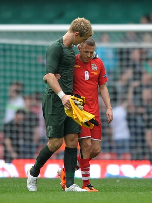 26.03.11 - Wales v England - Euro 2012 Qualifier - Joe Hart of England consoles Craig Bellamy of Wales at the end of the game. 