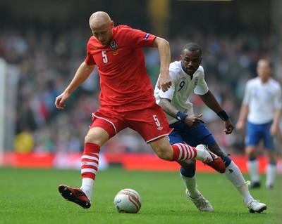 26.03.11 - Wales v England - Euro 2012 Qualifier - James Collins of Wales is challenged by Darren Bent of England. 