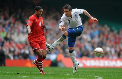 26.03.11 - Wales v England - Euro 2012 Qualifier - Frank Lampard of England shot is blocked by Ashley Williams of Wales. 