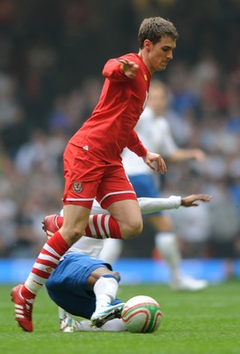 26.03.11 - Wales v England - Euro 2012 Qualifier - Aaron Ramsey of Wales is tackled by Ashley Young of England. 