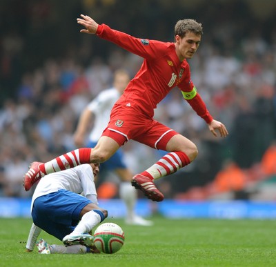26.03.11 - Wales v England - Euro 2012 Qualifier - Aaron Ramsey of Wales is tackled by Ashley Young of England. 
